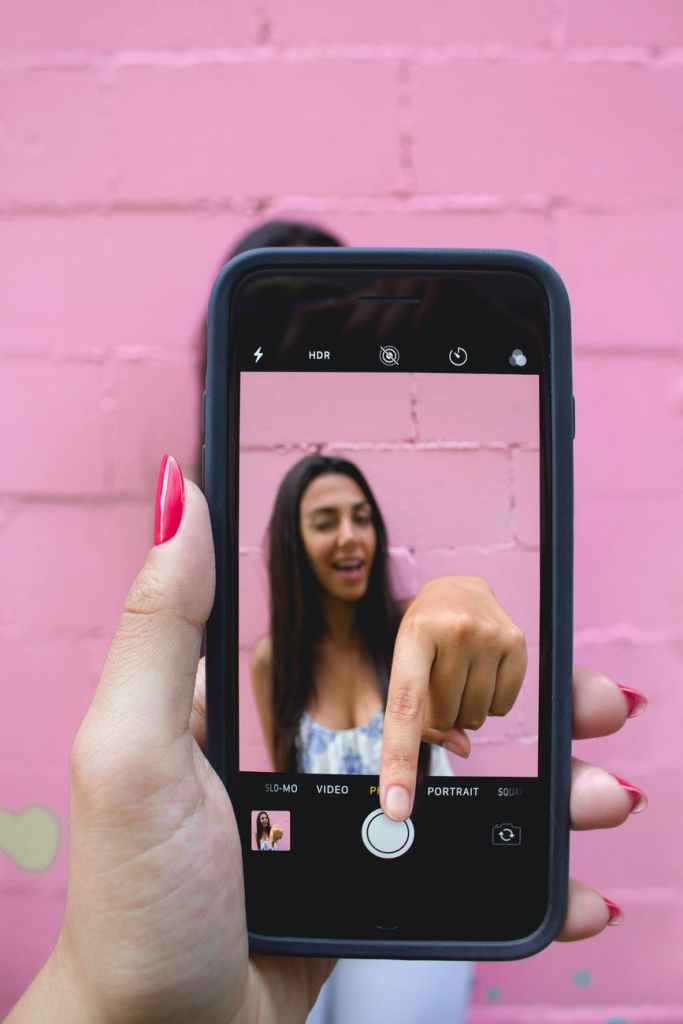 photo of person holding iphone