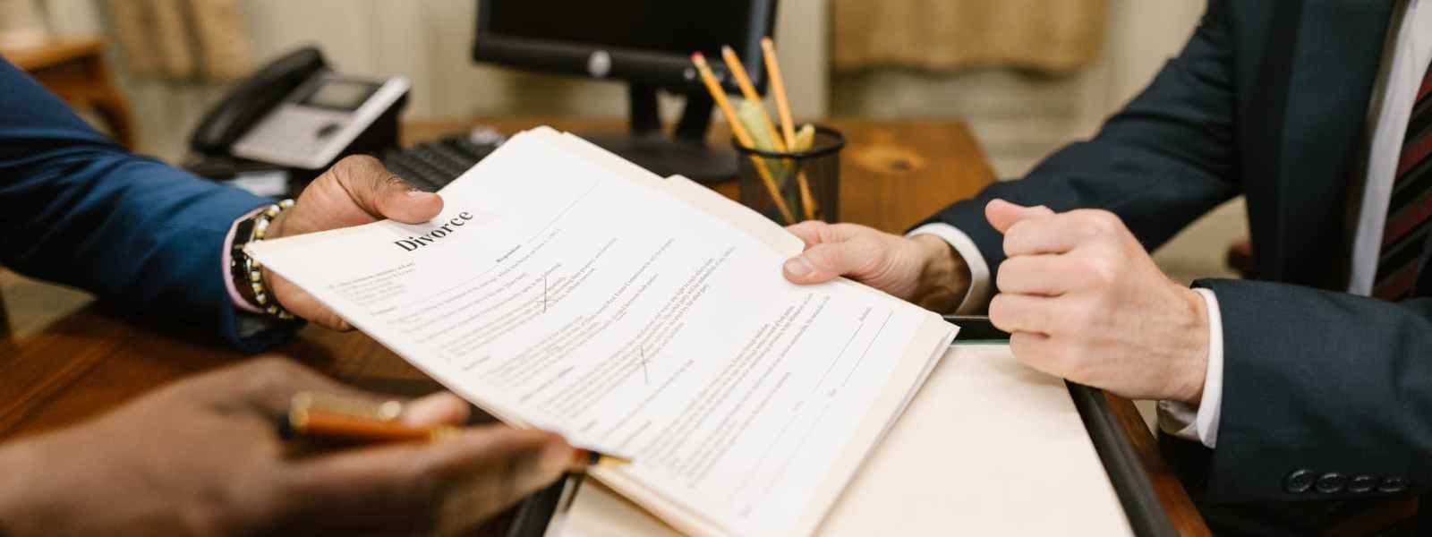 close up shot of a person holding divorce papers