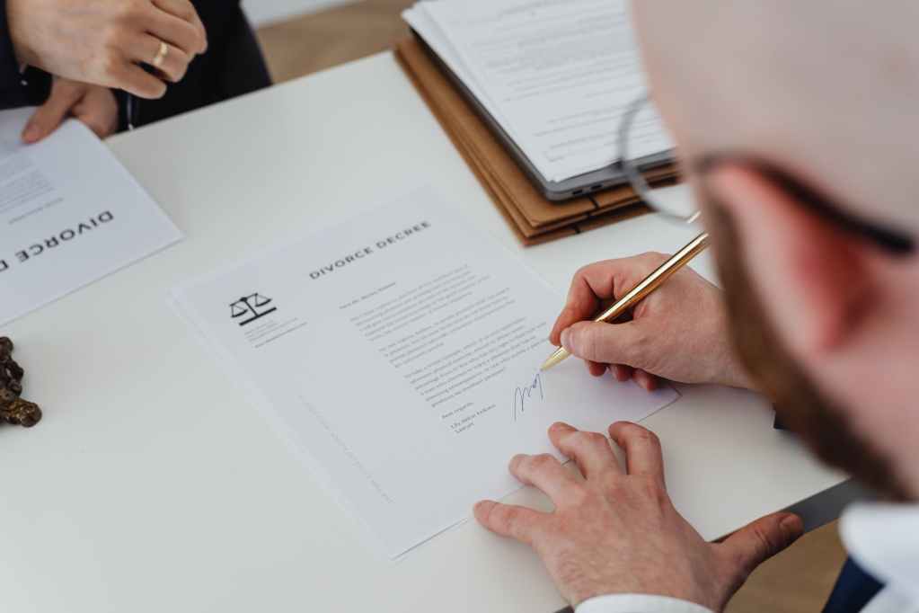 a person signing divorce documents