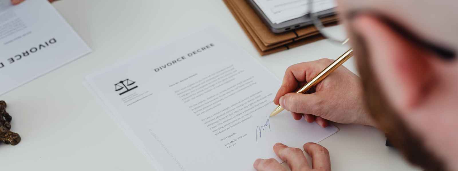 a person signing divorce documents