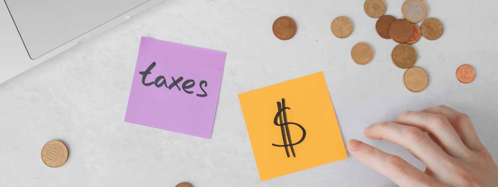 a sticky notes and coins on the table