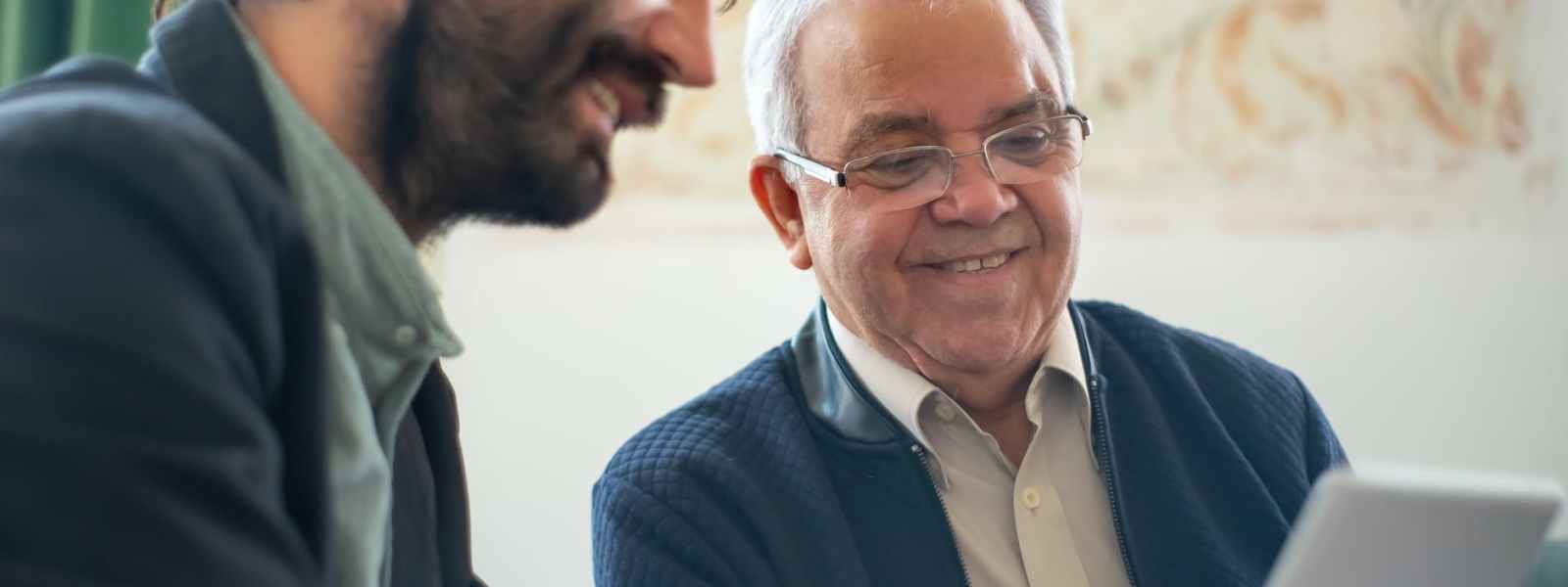 men looking at a laptop
