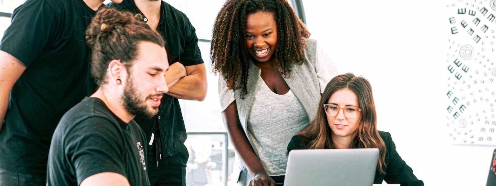 man in black crew neck t shirt sitting beside woman in gray crew neck t shirt