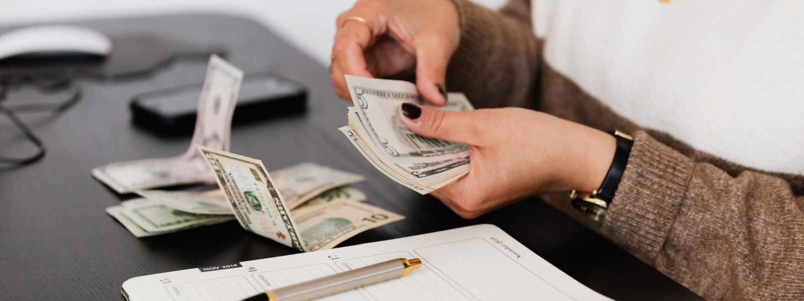 person counting cash money