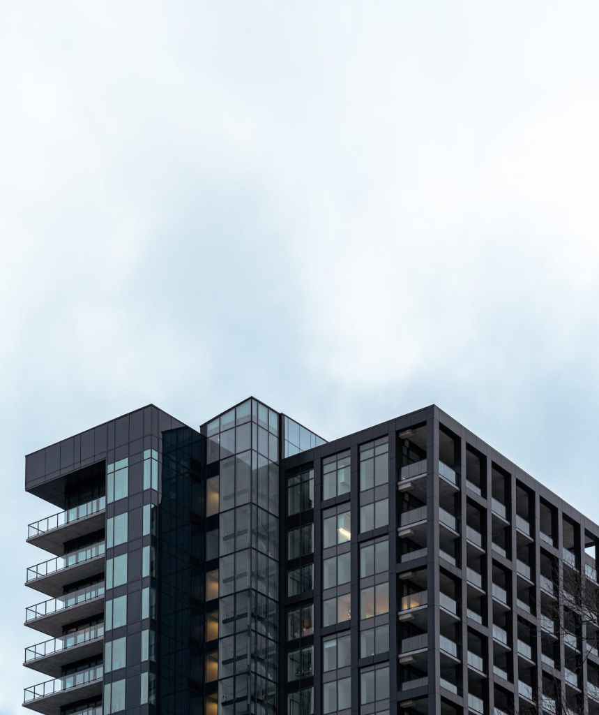modern multistage house exterior under cloudy sky in city