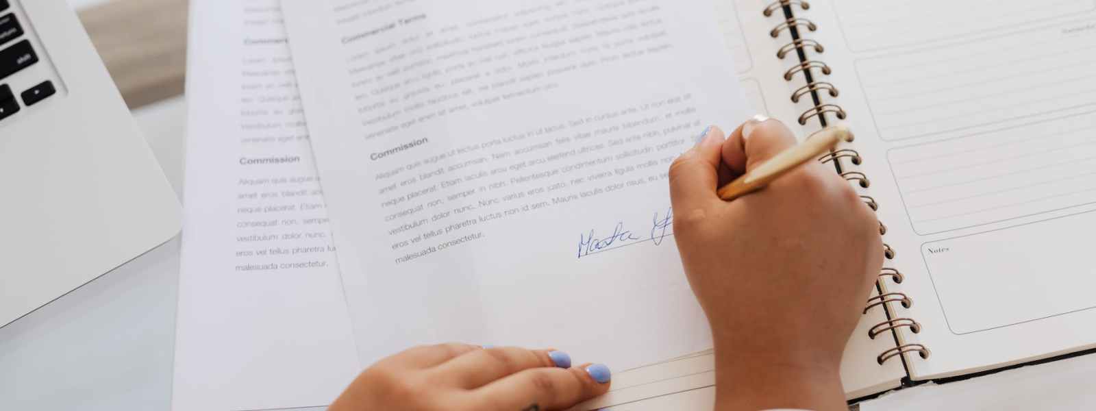 person signing a contract