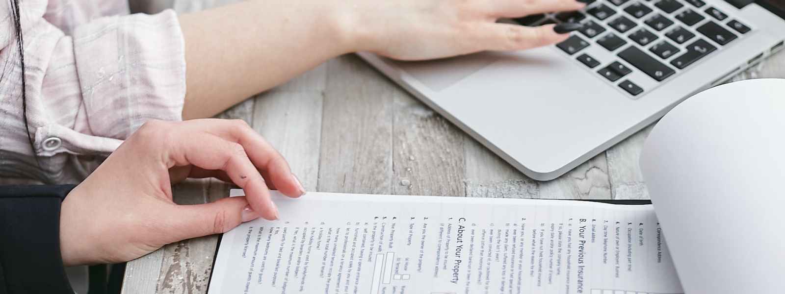 a person typing on laptop