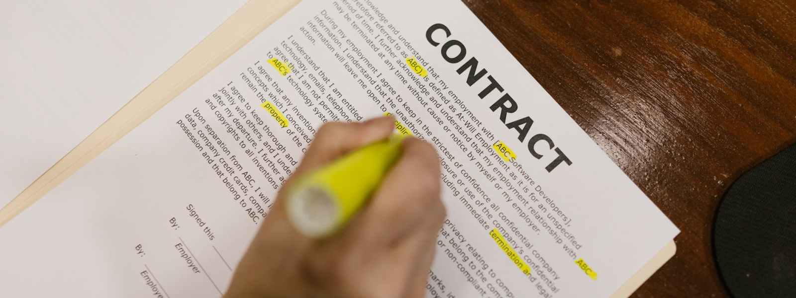 close up shot of a person holding a contract