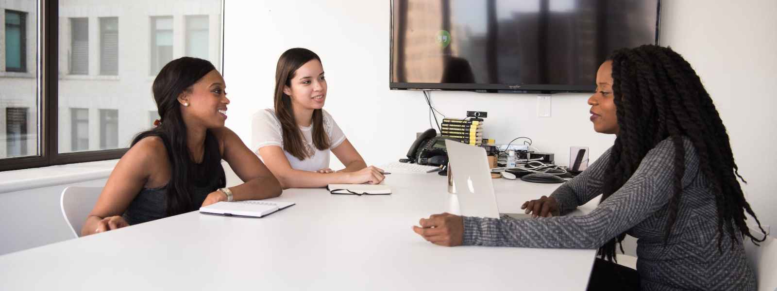 group of women sitting on chairs