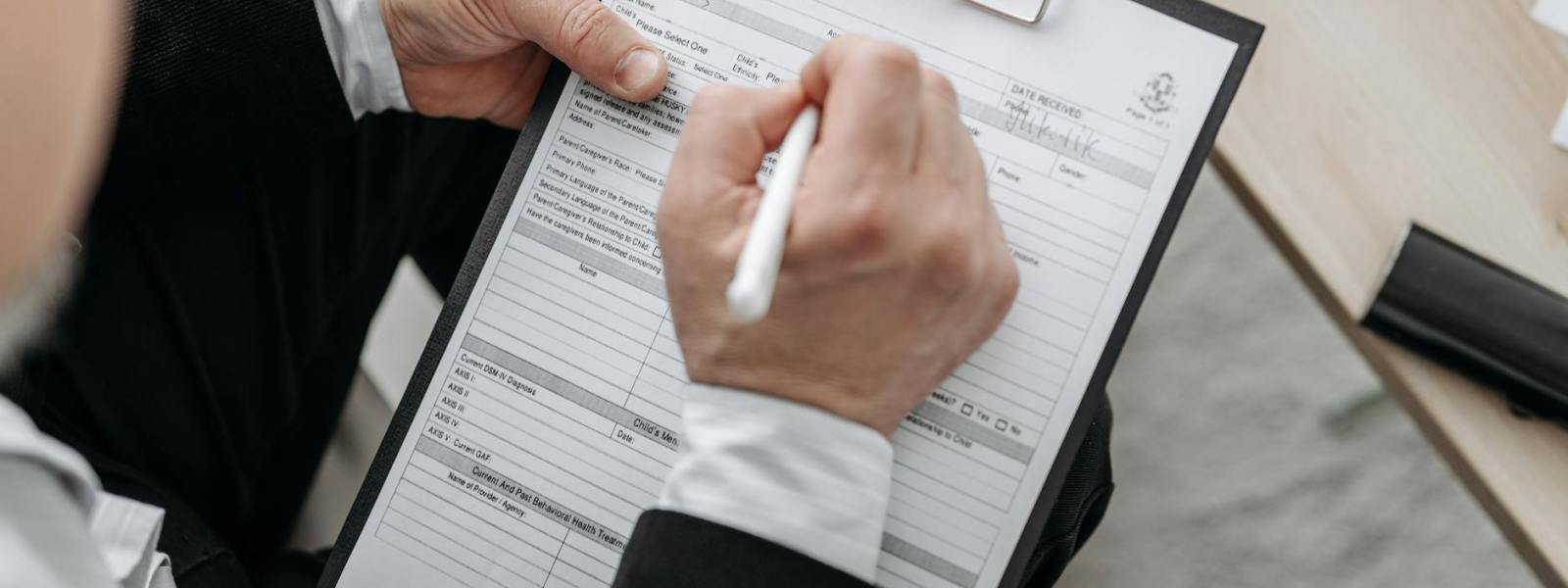 person signing a document