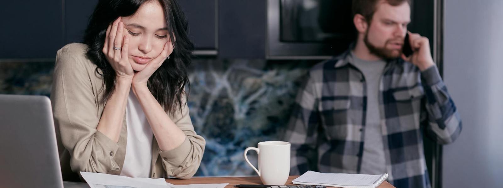 woman in white long sleeve shirt sitting beside man in black and white checkered dress shirt
