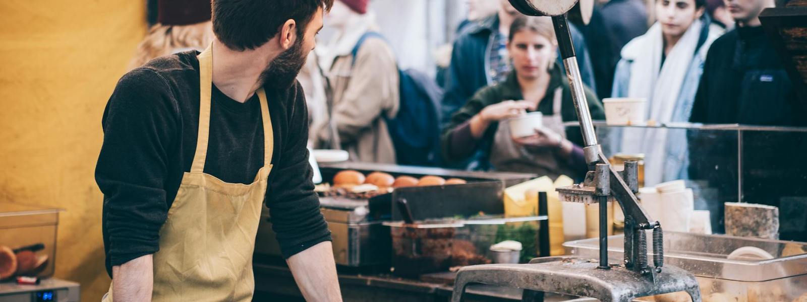 man standing in front of bowl and looking towards left